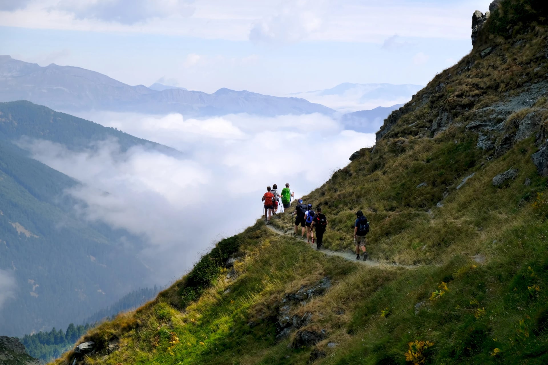 Hikers above the clouds on Gjeravica, Kosovo