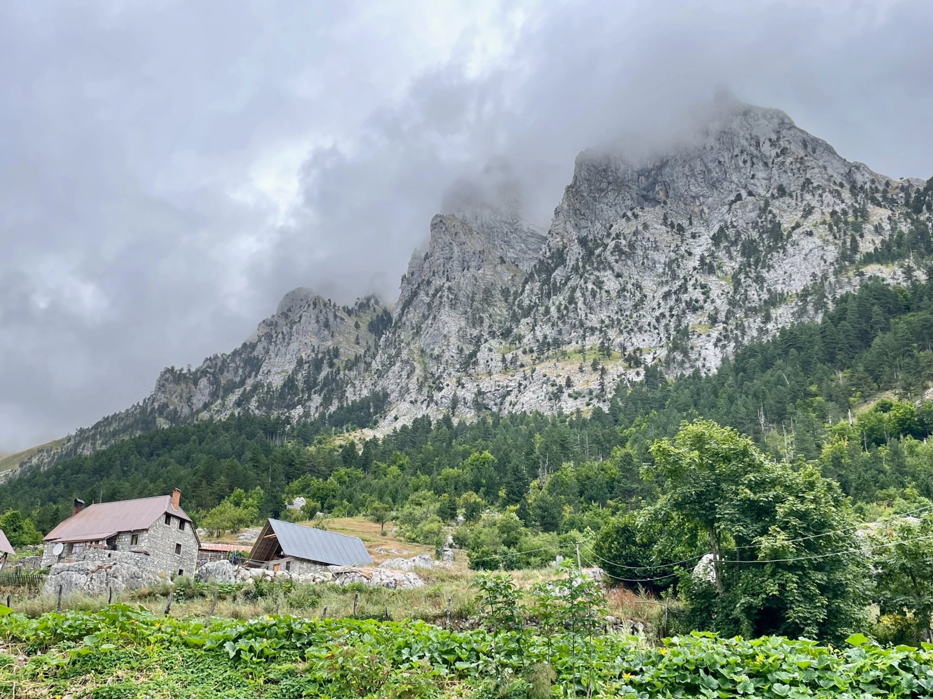 Stone huts and meadows on the Valbona to Theth trek