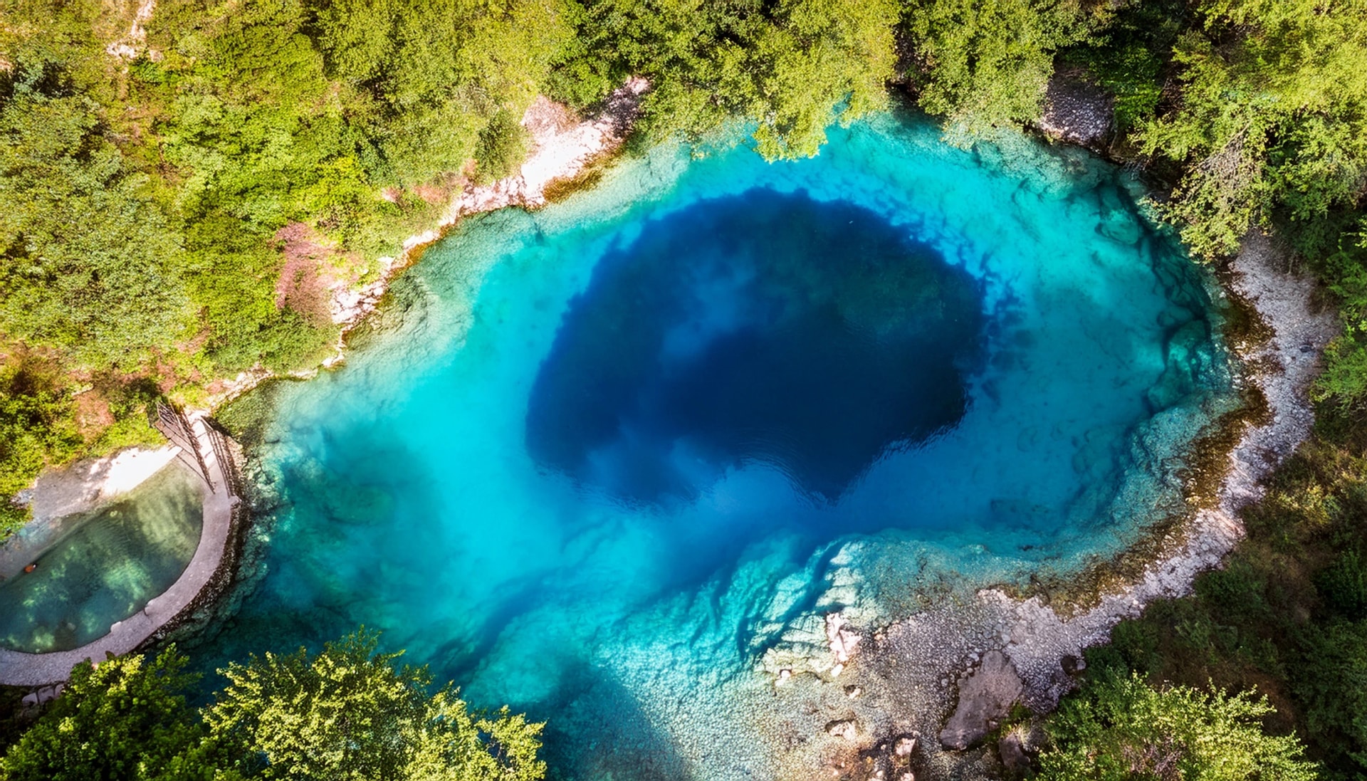 aerial view of the stunning blue eye natural water pool in southern albania albania blue eye natural water